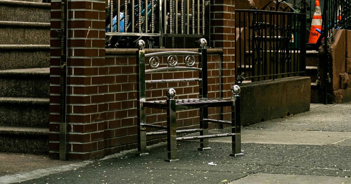 assembled from steel fence components, white picket chair challenges the american dream