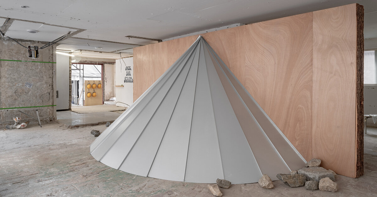 timber and steel sculptures occupy raw concrete shell in seoul before demolition