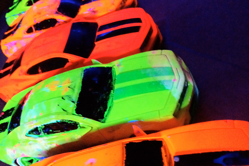 fluorescent car painting using RC cars for brushes