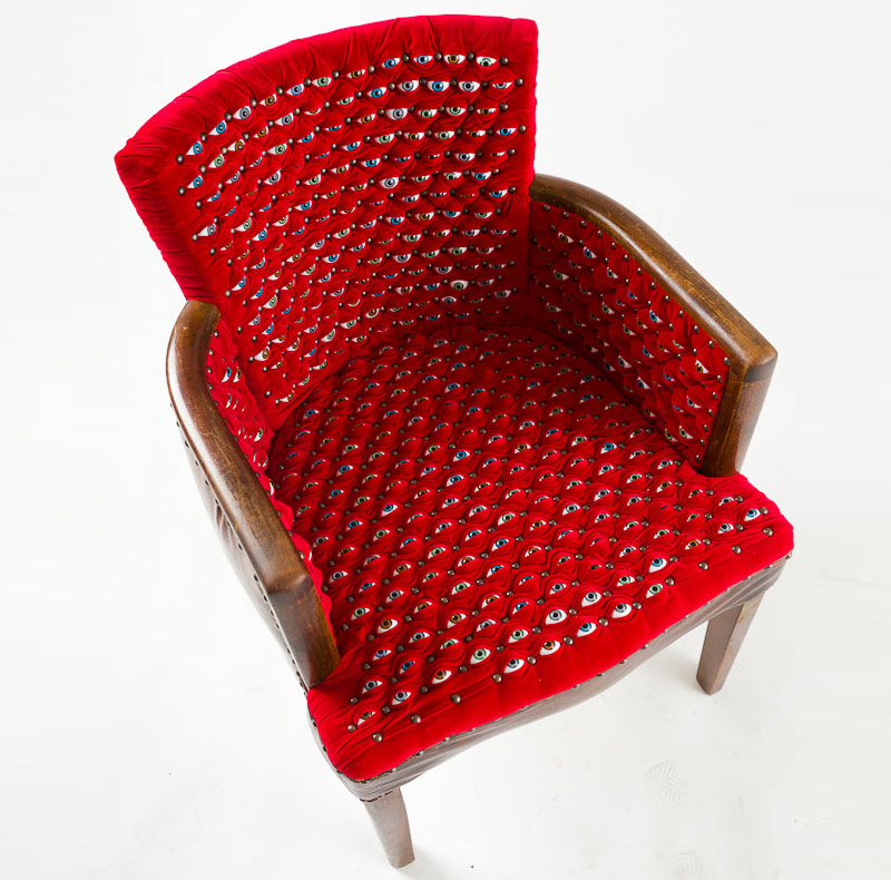 hundreds of eyes make up the scopophilia chair by fiona roberts