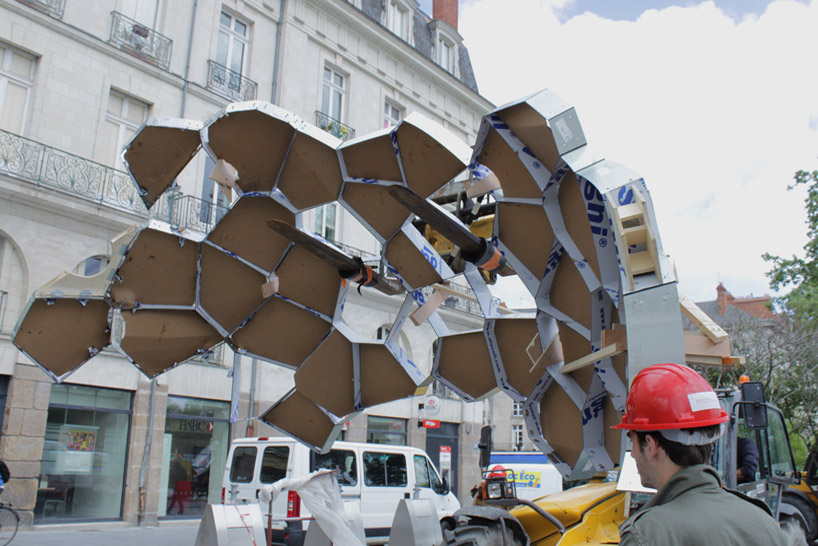 suspended sculpture composed of 1200 mirrors reflects french cityscape