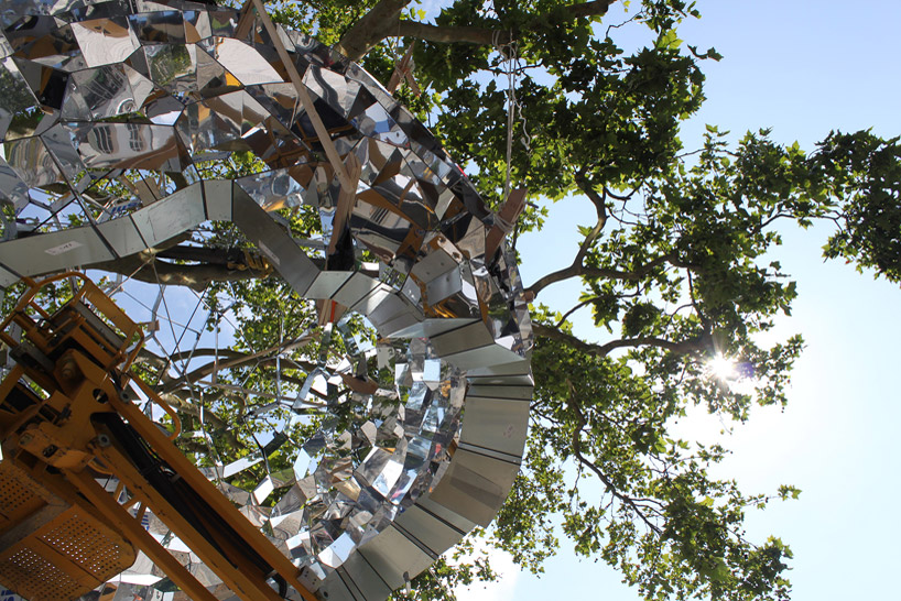 suspended sculpture composed of 1200 mirrors reflects french cityscape