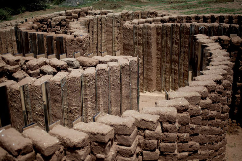 mud brick and mirror spiral installation by elin hansdottir