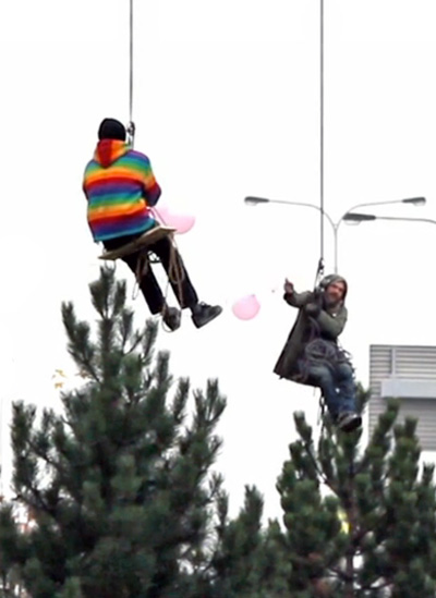 czech artists turn billboard into guerrilla merry go round swing