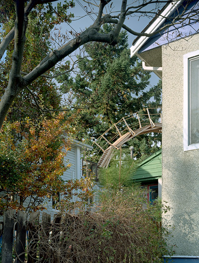 pedestrian residential wooden bridge by reece terris