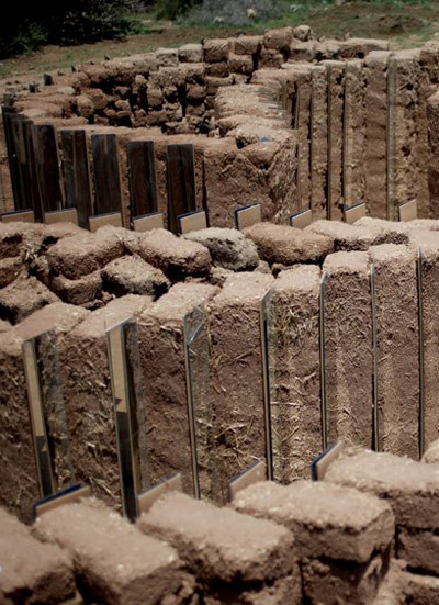 mud brick and mirror spiral installation by elin hansdottir
