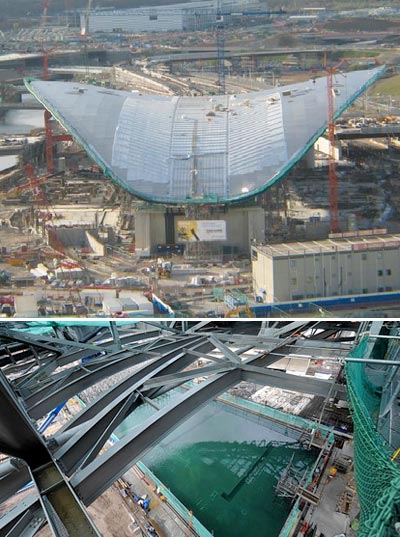 zaha hadid's olympic pools for 2012 aquatic centre filled