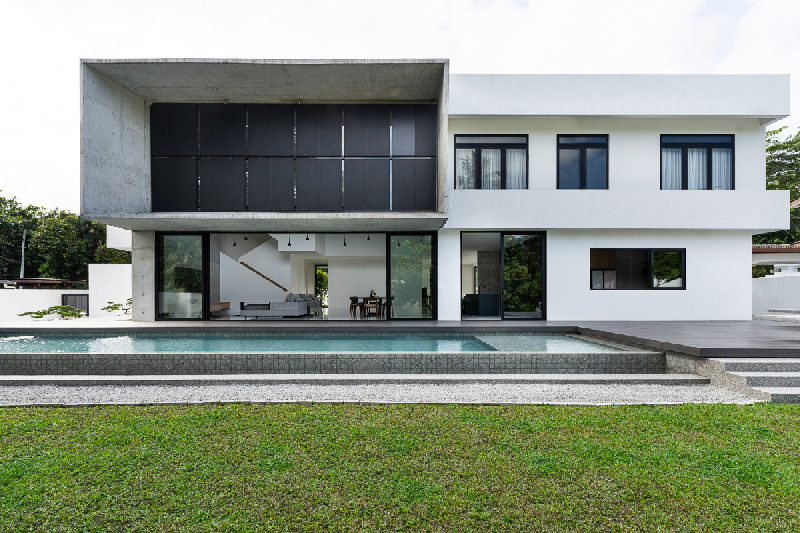 vast shuttered wall blurs thresholds at fabian tan's concrete house in kuala lumpur 