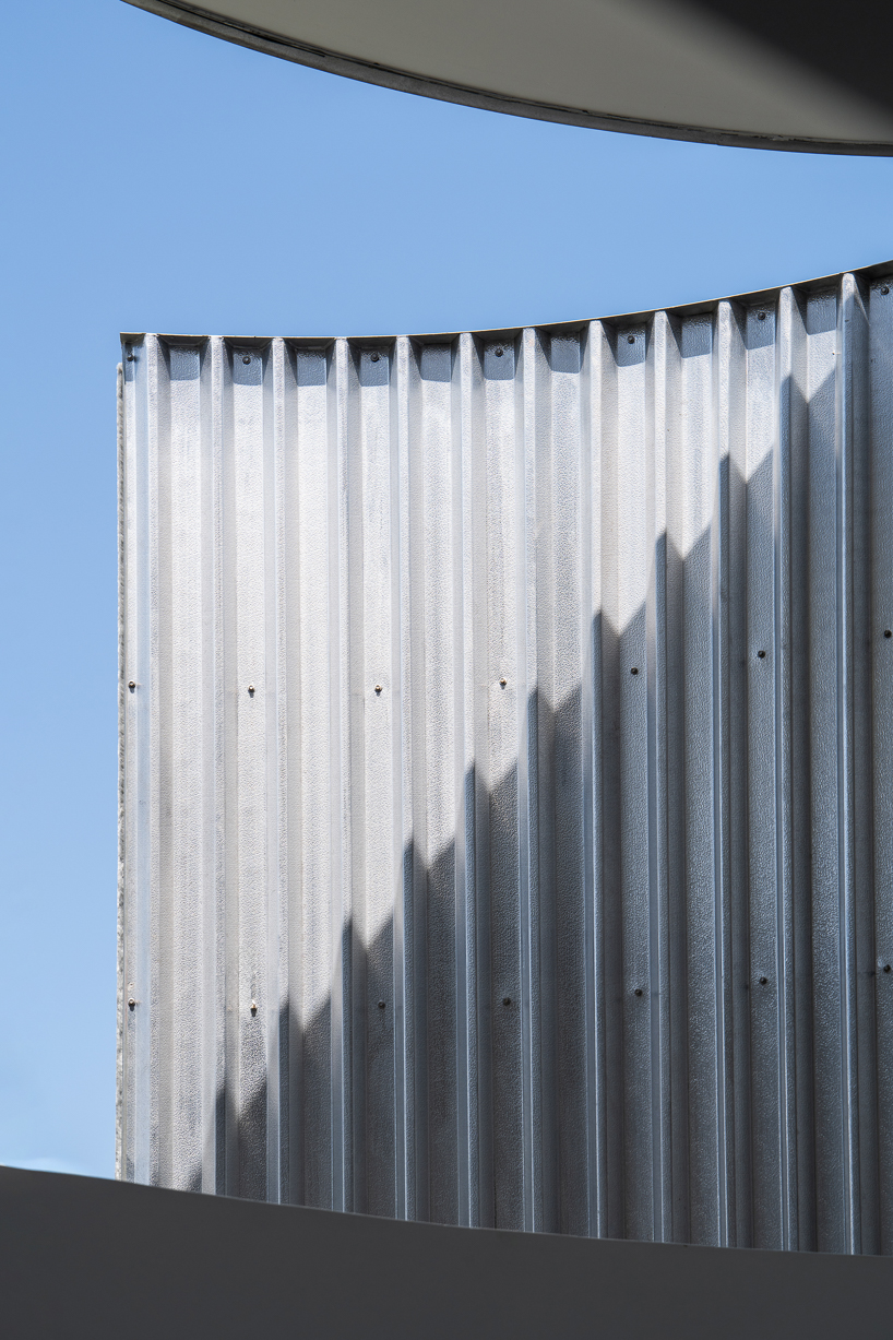 operable metal portal opens fabian tan's kuala lumpur house to the sky
