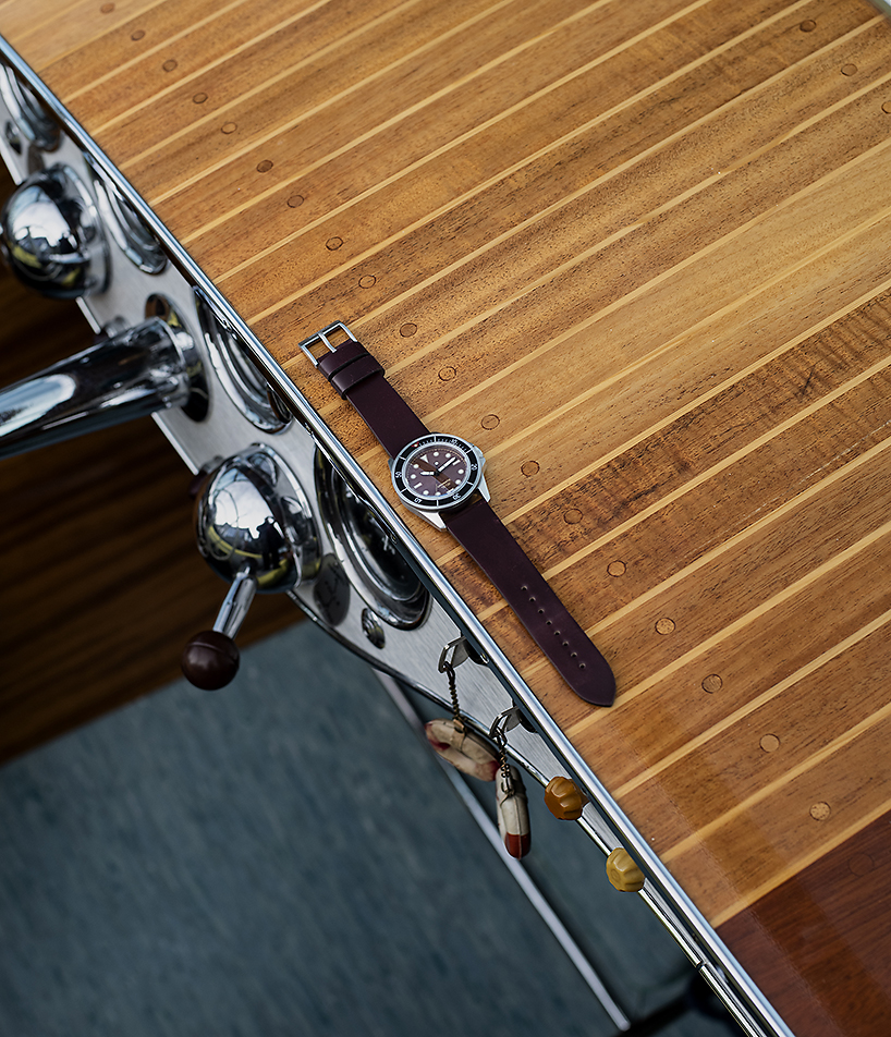 UNIMATIC x massena LAB watch features a unique patina dial and tactile black bezel designboom