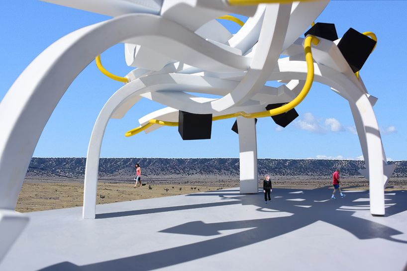 steel arrows, rods, and cubes intertwine to form michael jantzen's vast protein pavilion