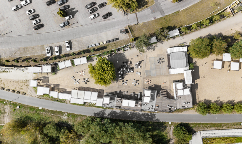 wiercinski studio recycles shipping containers for cultural center in poland designboom