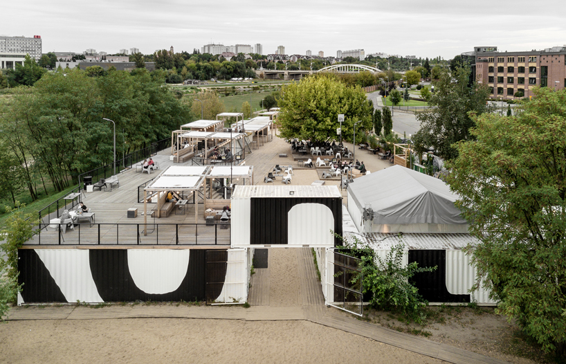 wiercinski studio recycles shipping containers for cultural center in poland designboom
