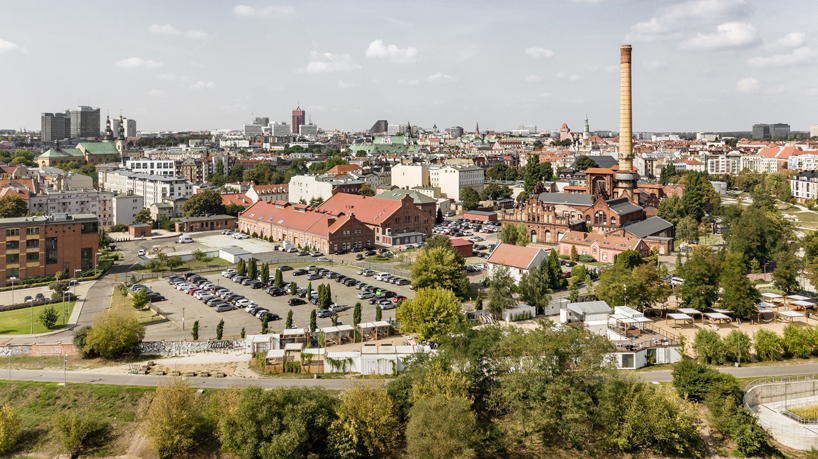 wiercinski studio recycles shipping containers for cultural center in poland designboom