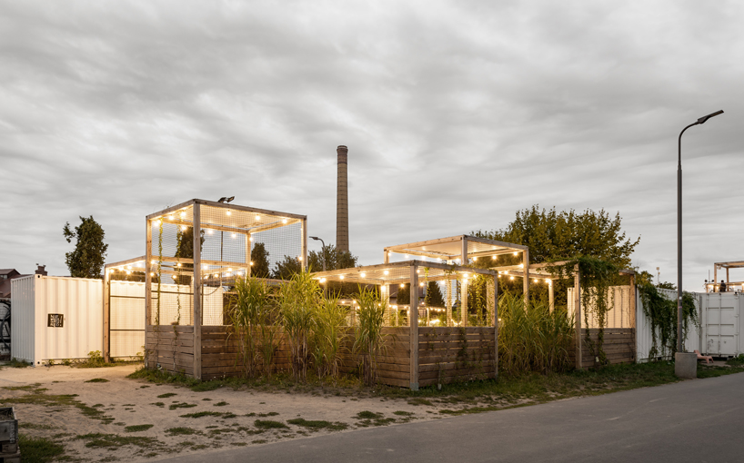 wiercinski studio recycles shipping containers for cultural center in poland designboom