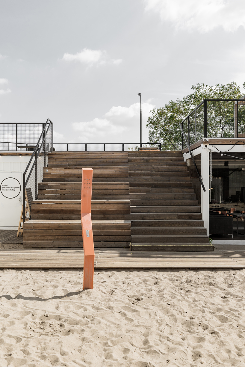 wiercinski studio recycles shipping containers for cultural center in poland designboom