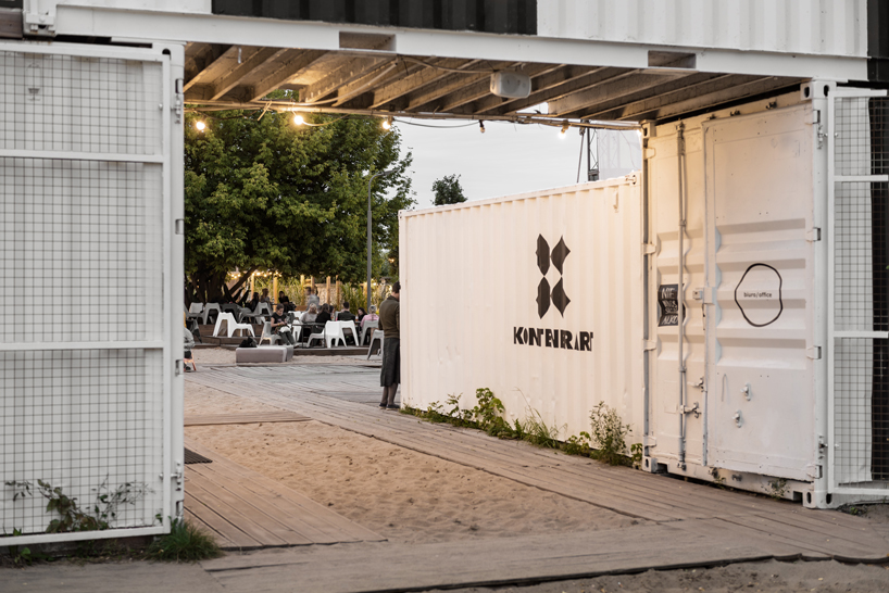 wiercinski studio recycles shipping containers for cultural center in poland designboom