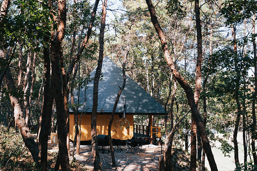 pyramid hipped roof tops wooden cabin in chinese woodland
