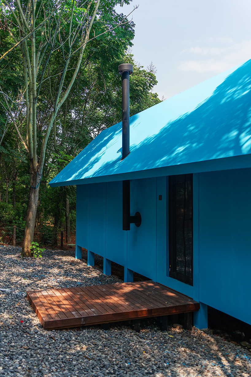 double slope roof tops wiki world's blue wooden cabin engulfed in chinese forest