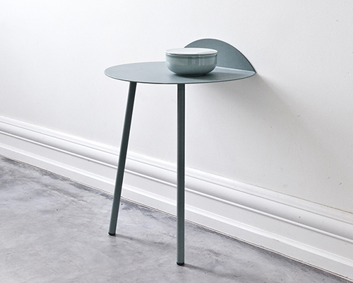 kenyon yeh develops the two-legged yeh wall table for menu