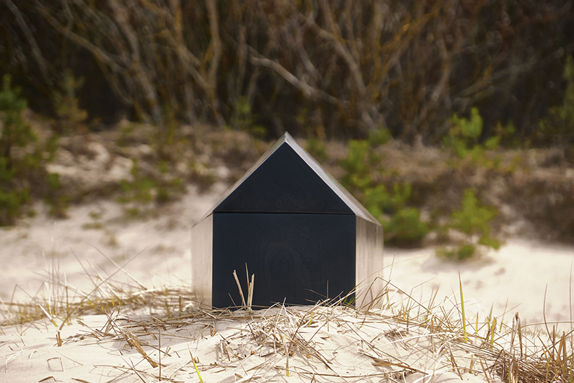 NRJA designs a black, house-shaped coffin for architects designboom