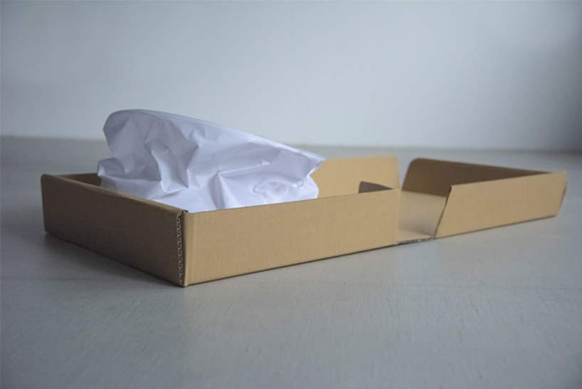 kazuhiro yamanaka’s crinkled paper and recycled polyester lamp fits inside a pizza box