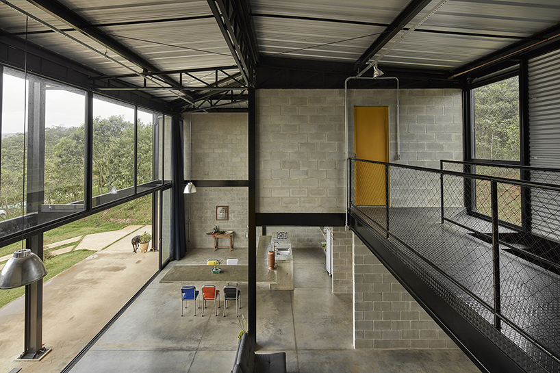 'casa galpao' by marcos franchini in brazil combines steel framing and exposed concrete