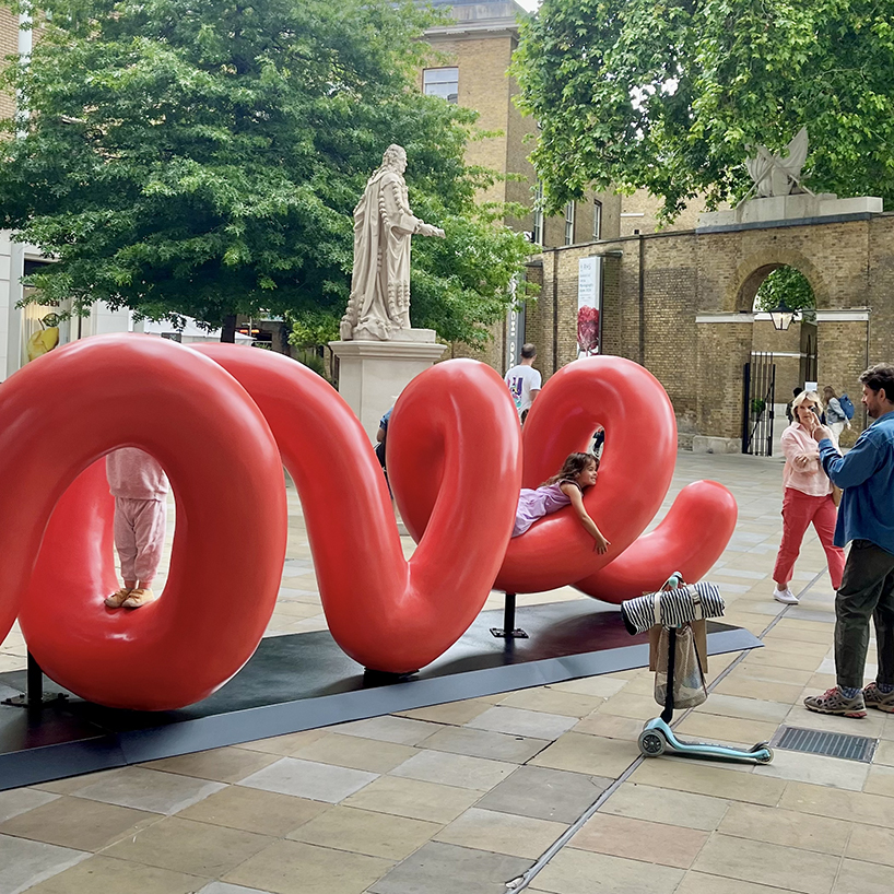 yoni alter's climbable, looping sculpture in london unravels to reveal the word 'love'