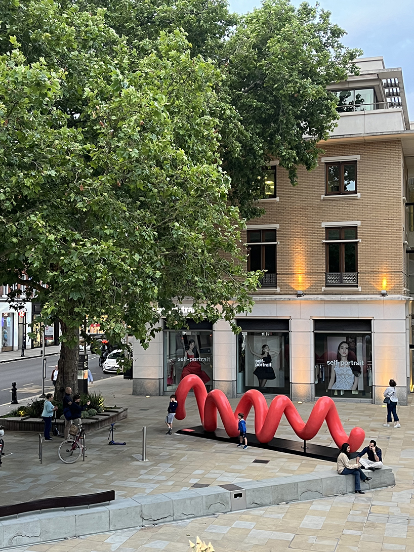 yoni alter's climbable, looping sculpture in london unravels to reveal the word 'love'