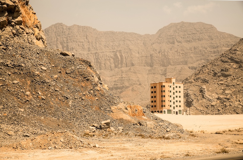 architecture contrasts against arid rock formations in manuel álvarez diestro's photo series