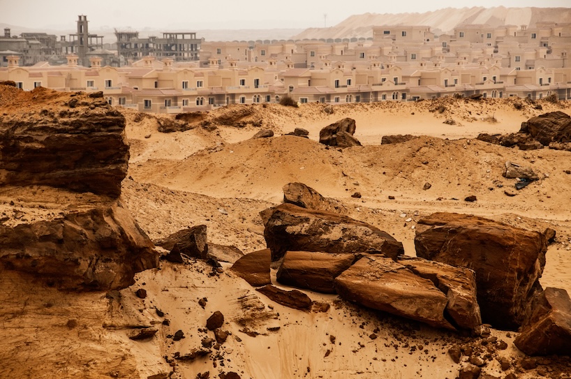 architecture contrasts against arid rock formations in manuel álvarez diestro's photo series