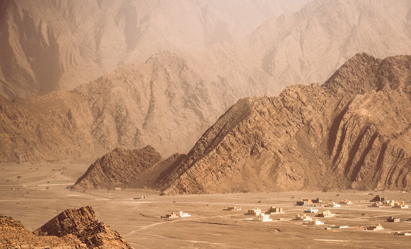 architecture contrasts against arid rock formations in manuel álvarez diestro's photo series