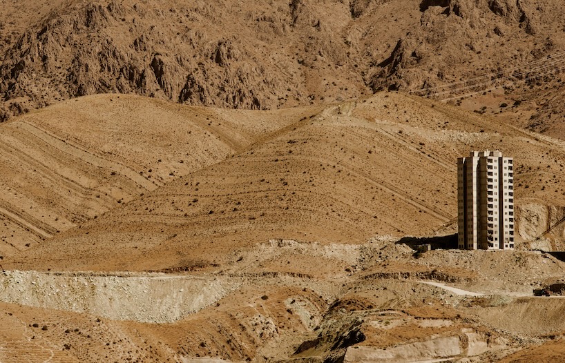 architecture contrasts against arid rock formations in manuel álvarez diestro's photo series
