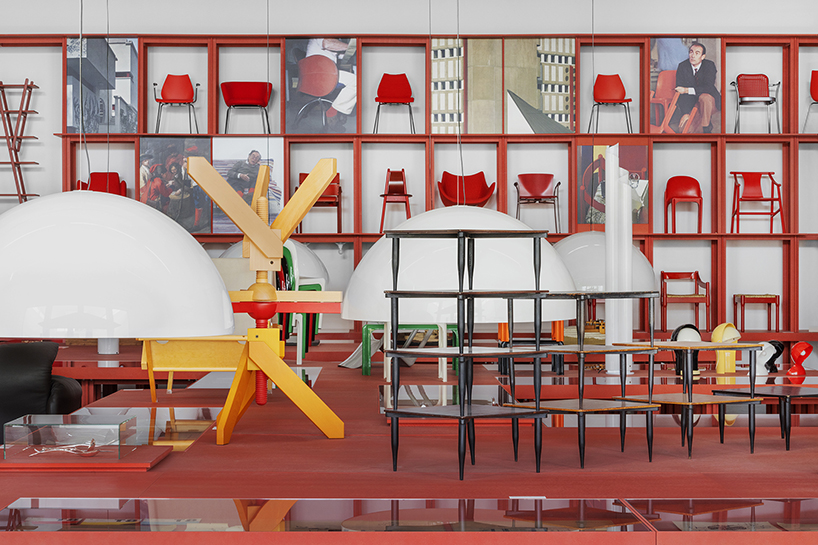 bright red installation by binocle displays vico magistretti's works at the trienalle di milano