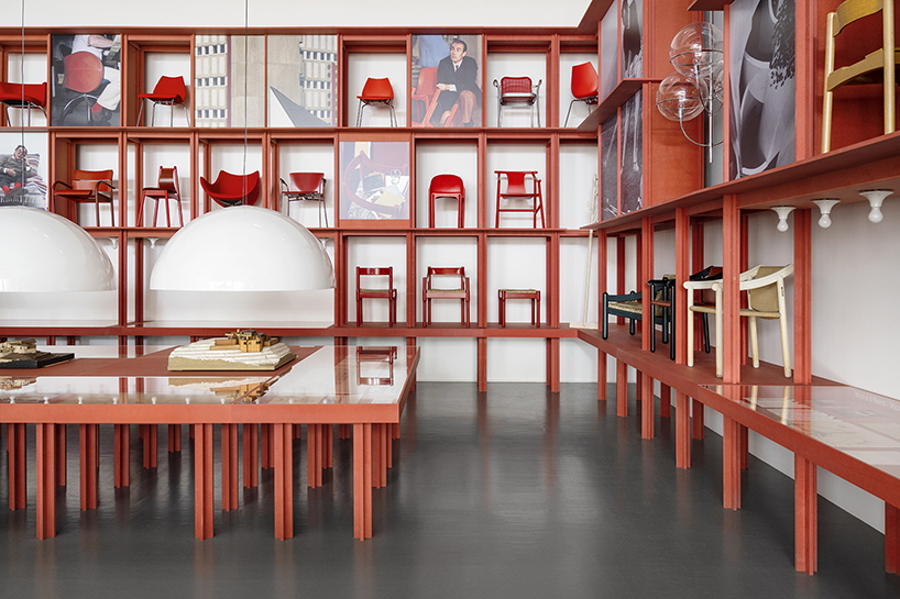 bright red installation by binocle displays vico magistretti's works at the trienalle di milano