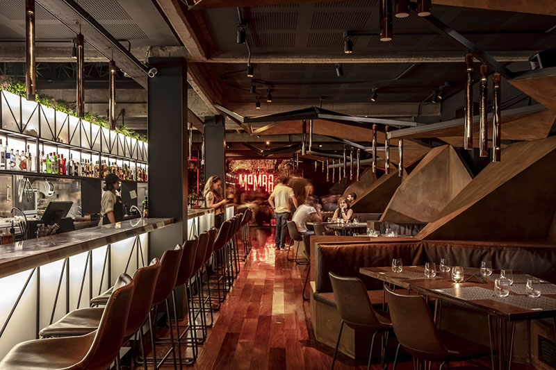 estudio HMA's mamba bar fuses oxidised iron tones with greenery in buenos aires