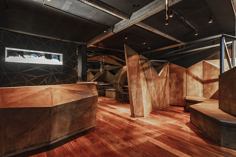 estudio HMA's mamba bar fuses oxidised iron tones with greenery in buenos aires