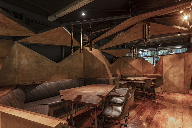 estudio HMA's mamba bar fuses oxidised iron tones with greenery in buenos aires