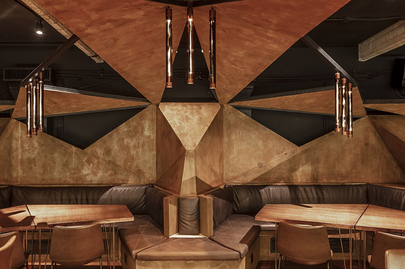 estudio HMA's mamba bar fuses oxidised iron tones with greenery in buenos aires