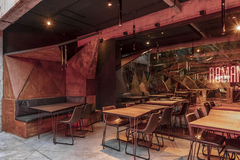 estudio HMA's mamba bar fuses oxidised iron tones with greenery in buenos aires