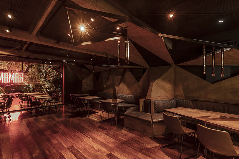 estudio HMA's mamba bar fuses oxidised iron tones with greenery in buenos aires