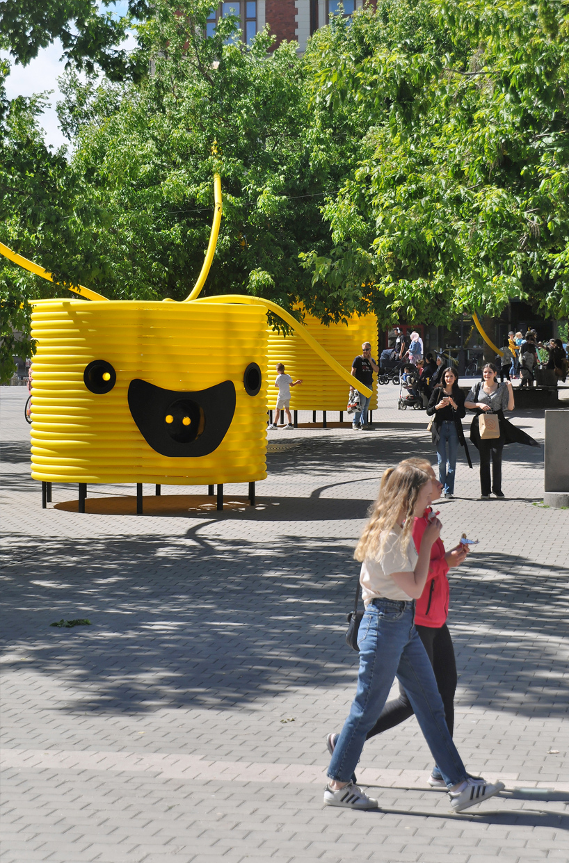 moradavaga’s giant yellow characters are acoustically interconnected in square in sweden