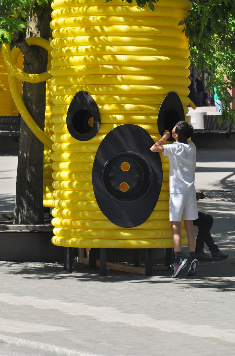 moradavaga’s giant yellow characters are acoustically interconnected in square in sweden