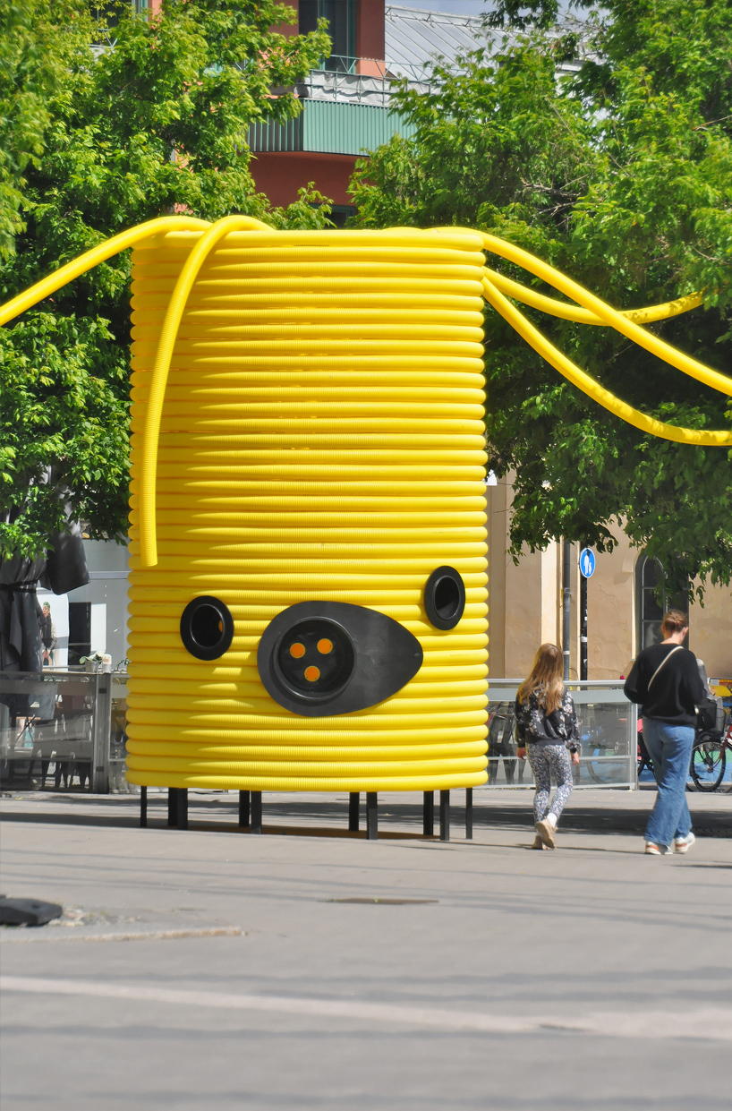 moradavaga’s giant yellow characters are acoustically interconnected in square in sweden