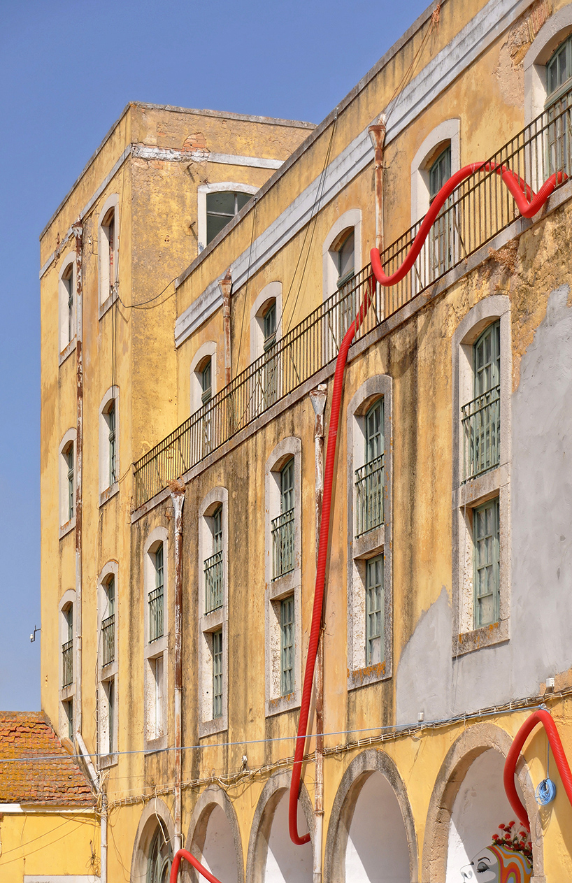 interactive giant squids tentacles embrace old beer factory on the margins of ria formosa 11