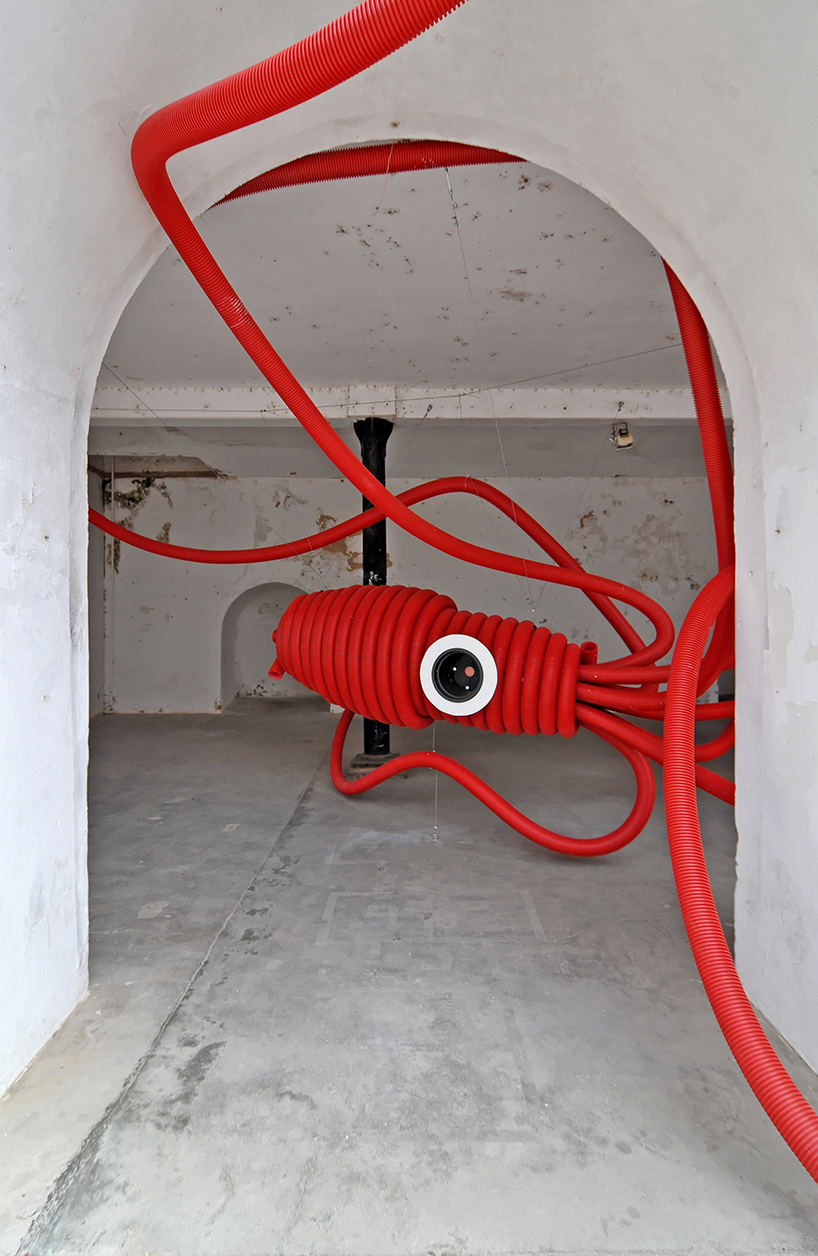 moradavaga's giant squid's tentacles embrace old beer factory in portugal
