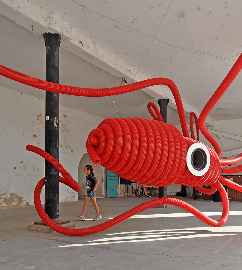 moradavaga's giant squid's tentacles embrace old beer factory in portugal