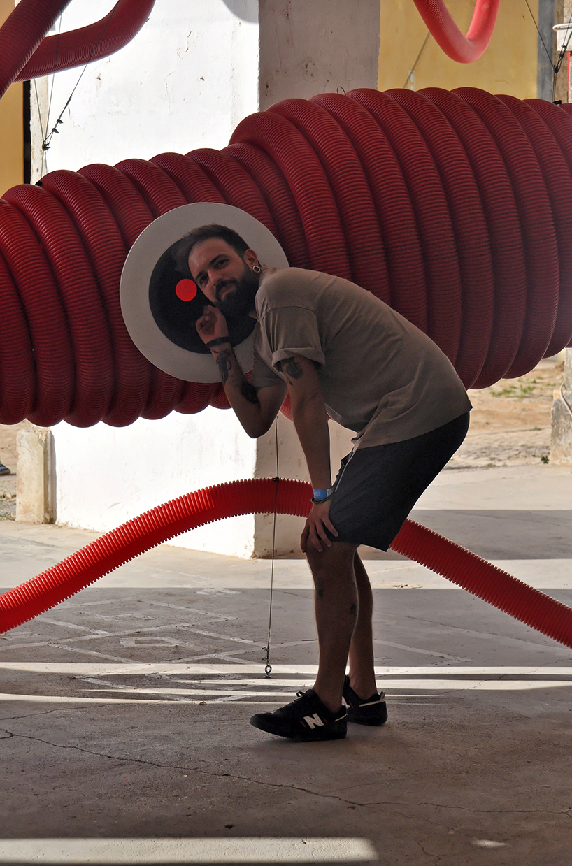 moradavaga's giant squid's tentacles embrace old beer factory in portugal