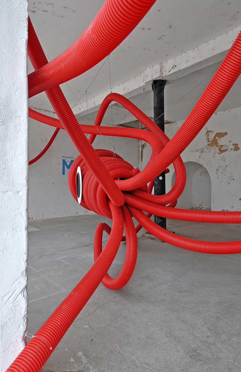 moradavaga's giant squid's tentacles embrace old beer factory in portugal