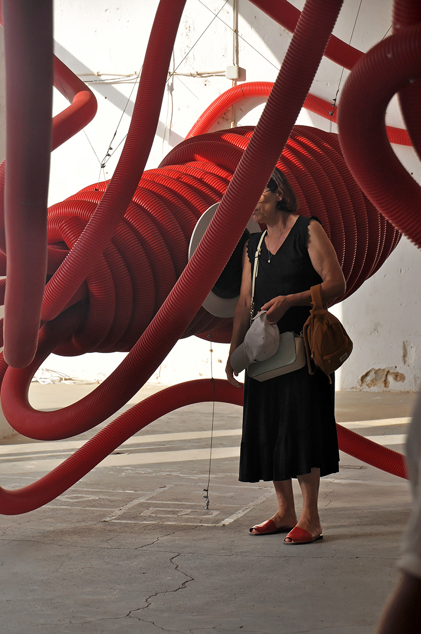 moradavaga's giant squid's tentacles embrace old beer factory in portugal